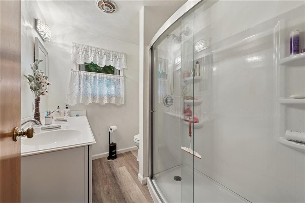 234 Ankney Hl Road Acme, PA 15610 - Photo 15 of 47 a bathroom with a shower sink and mirror