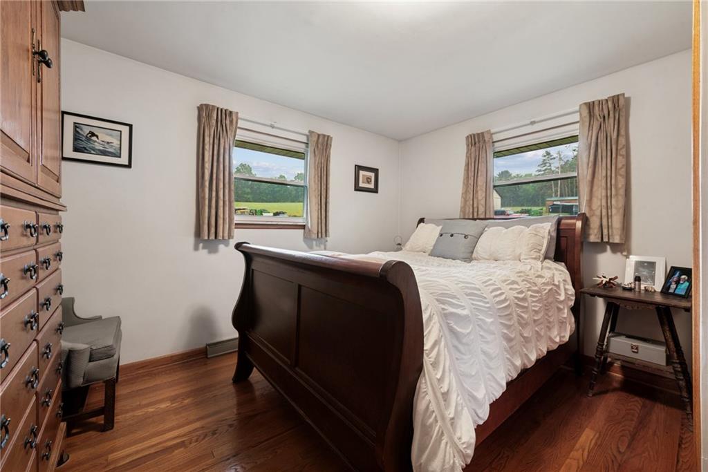 234 Ankney Hl Road Acme, PA 15610 - Photo 16 of 47 a bedroom with bed window and table