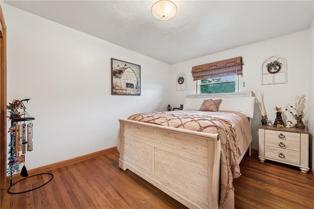 234 Ankney Hl Road Acme, PA 15610 - Photo 18 of 47 a bedroom with a bed and a table