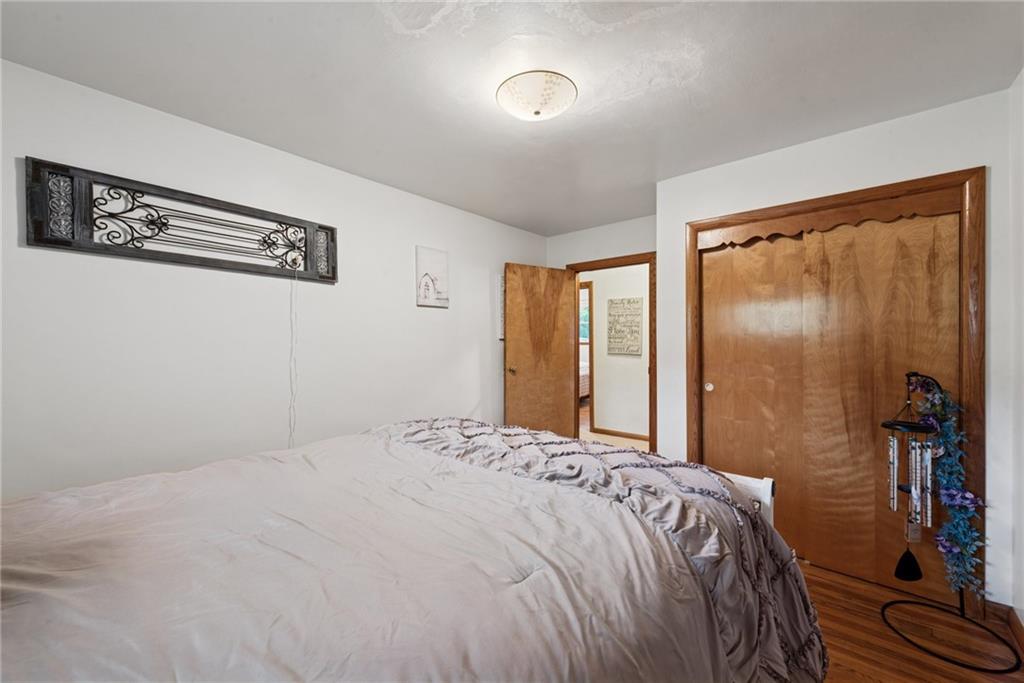 234 Ankney Hl Road Acme, PA 15610 - Photo 19 of 47 a bedroom with a bed and a large mirror