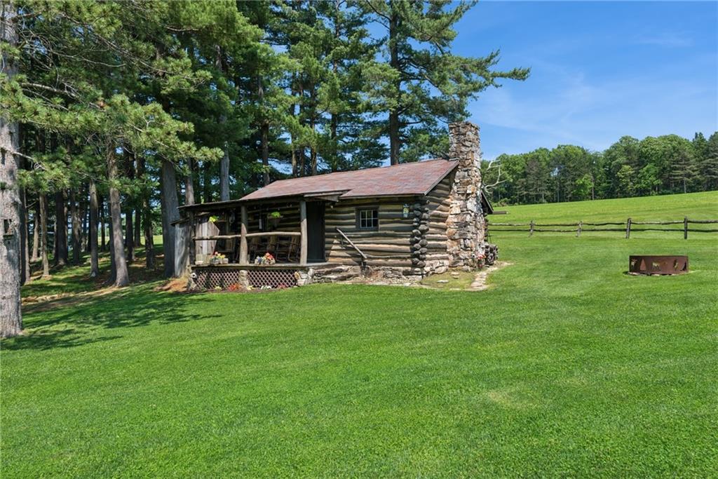 234 Ankney Hl Road Acme, PA 15610 - Photo 22 of 47 a view of a house with a backyard