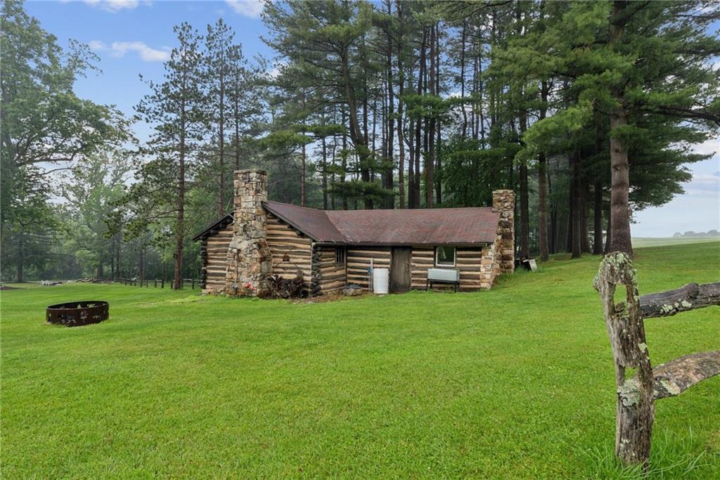 234 Ankney Hl Road Acme, PA 15610 - Photo 27 of 47 a view of a house with a yard
