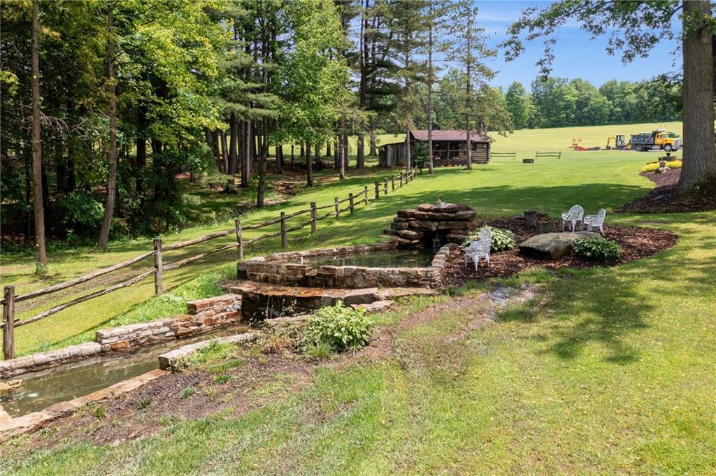 234 Ankney Hl Road Acme, PA 15610 - Photo 28 of 47 a garden view with a seating space
