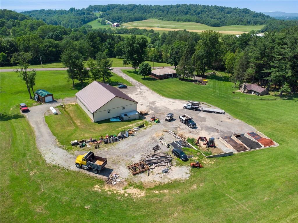 234 Ankney Hl Road Acme, PA 15610 - Photo 31 of 47 an aerial view of a house with outdoor space patio and mountain view in back