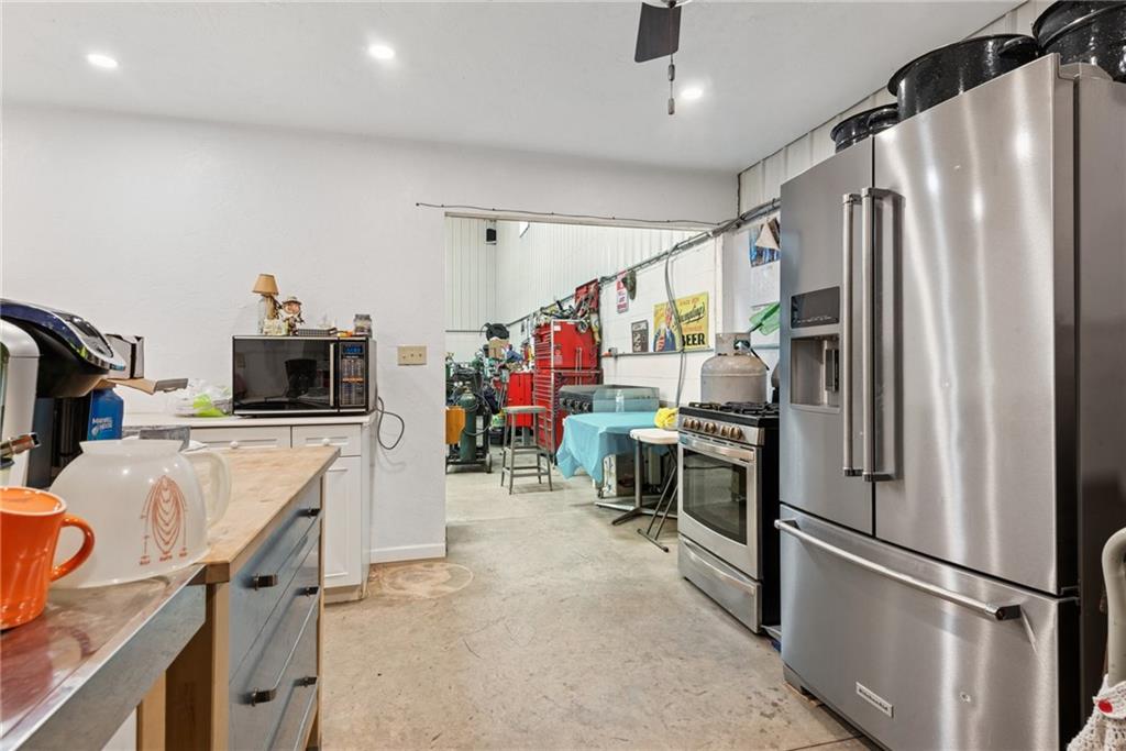 234 Ankney Hl Road Acme, PA 15610 - Photo 37 of 47 a kitchen with a refrigerator and a stove top oven