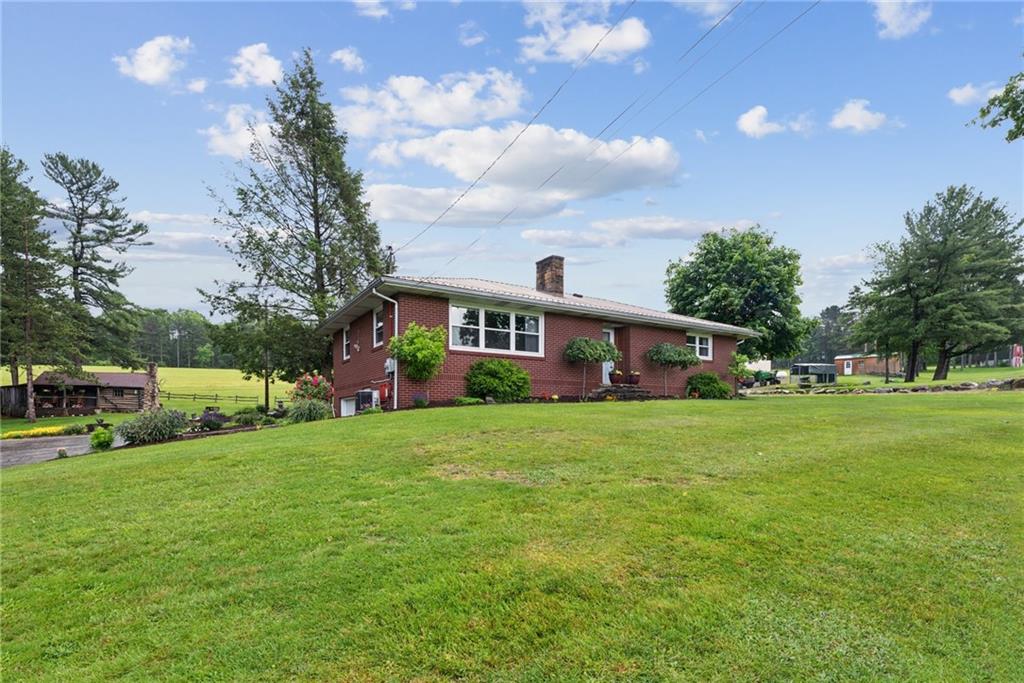 234 Ankney Hl Road Acme, PA 15610 - Photo 47 of 47 a front view of a house with garden