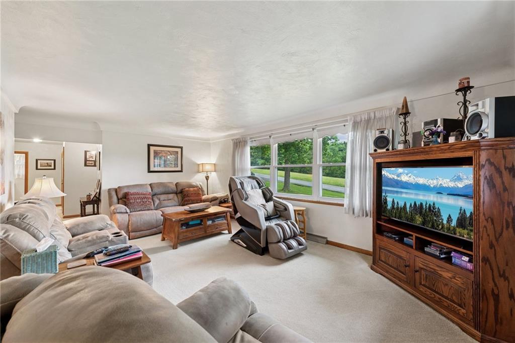 234 Ankney Hl Road Acme, PA 15610 - Photo 7 of 47 a living room with furniture and a flat screen tv