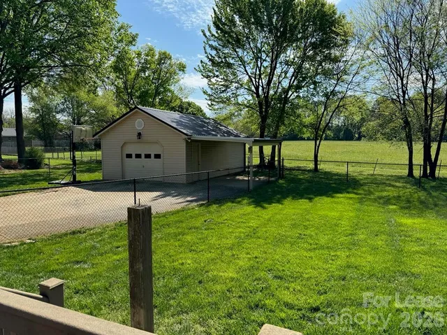 a kitchen with stainless steel appliances kitchen island granite countertop a sink and cabinets