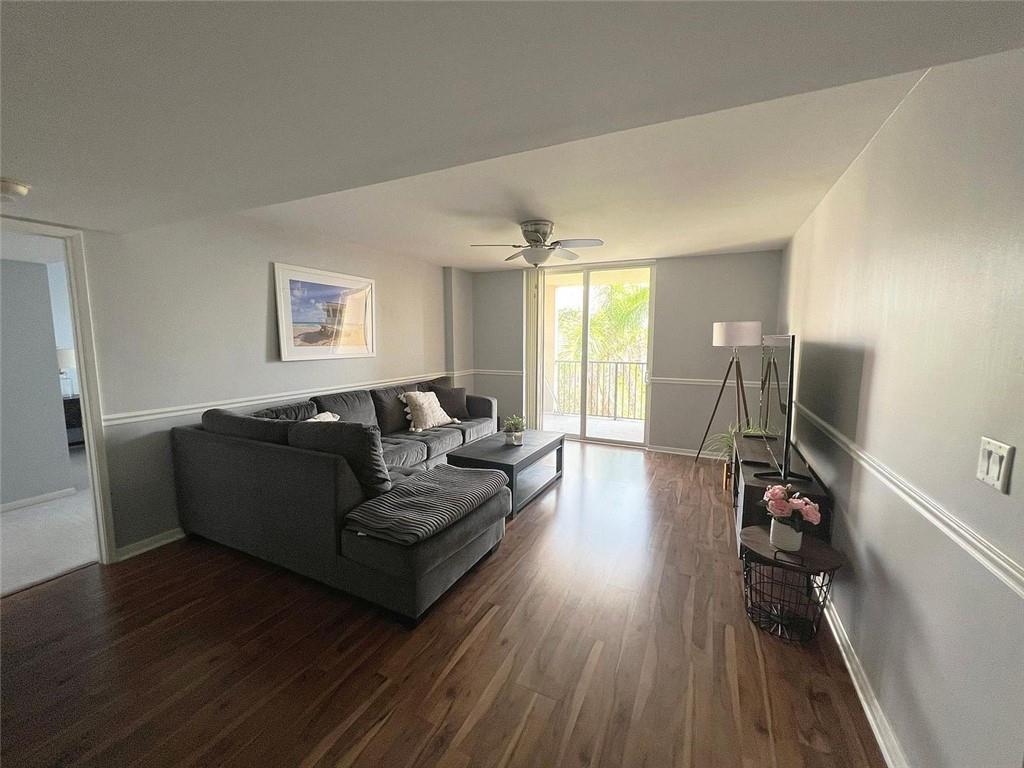520 Southeast 5th Avenue, Unit 1502 Fort Lauderdale, FL 33301 - Photo 3 of 17 a living room with furniture and a wooden floor