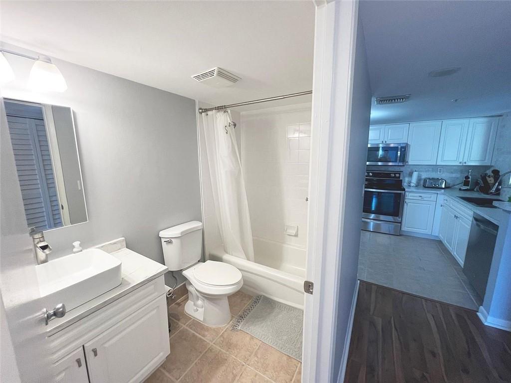 520 Southeast 5th Avenue, Unit 1502 Fort Lauderdale, FL 33301 - Photo 5 of 17 a bathroom with a sink and a mirror