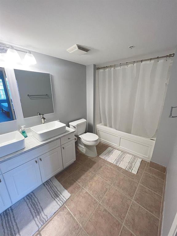 520 Southeast 5th Avenue, Unit 1502 Fort Lauderdale, FL 33301 - Photo 7 of 17 a bathroom with a double vanity sink toilet and a mirror