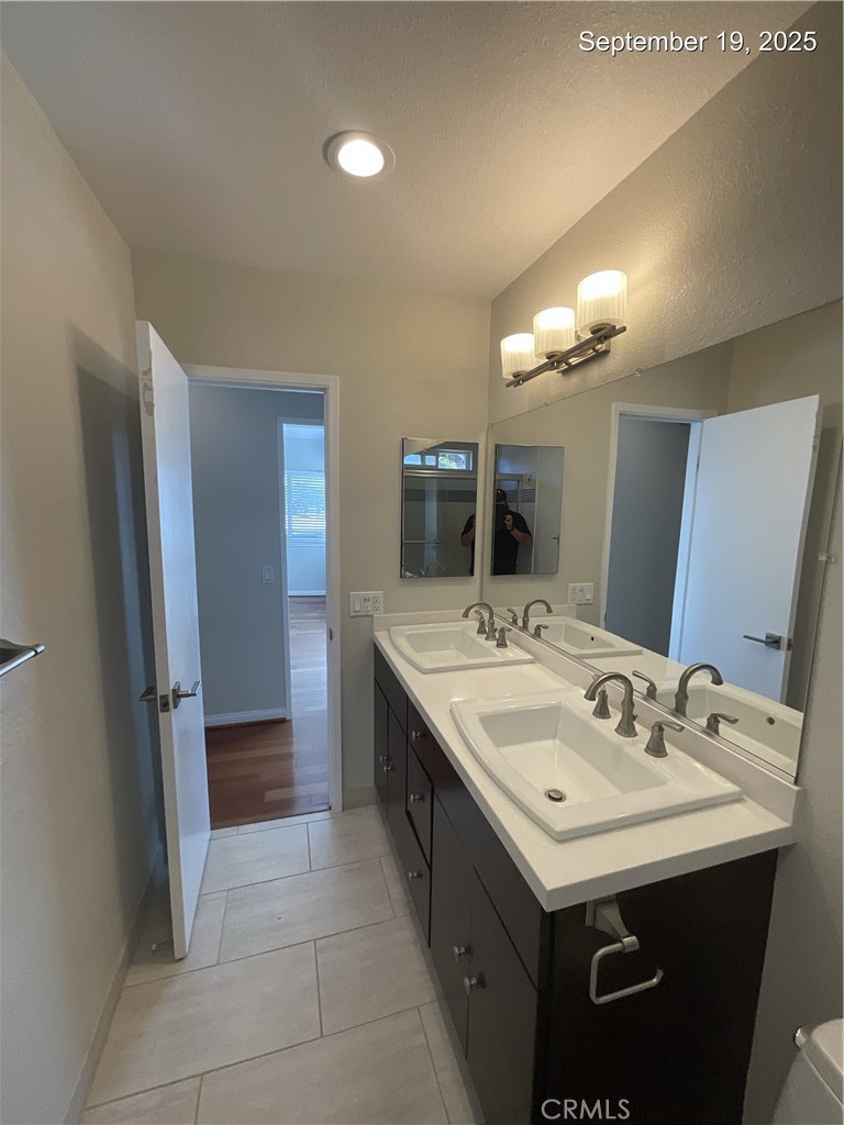 34021 Granada Drive, Unit B Dana Point, CA 92629 - Photo 21 of 23 a bathroom with a sink and a mirror
