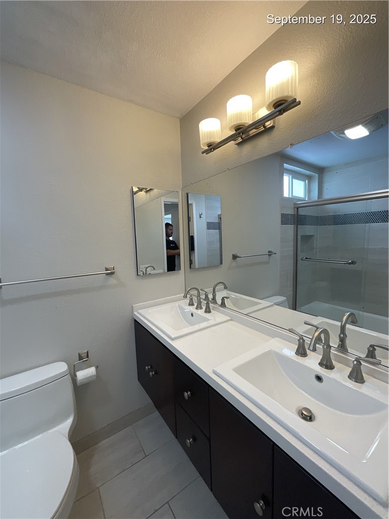 34021 Granada Drive, Unit B Dana Point, CA 92629 - Photo 10 of 23 a bathroom with a double vanity sink and a mirror