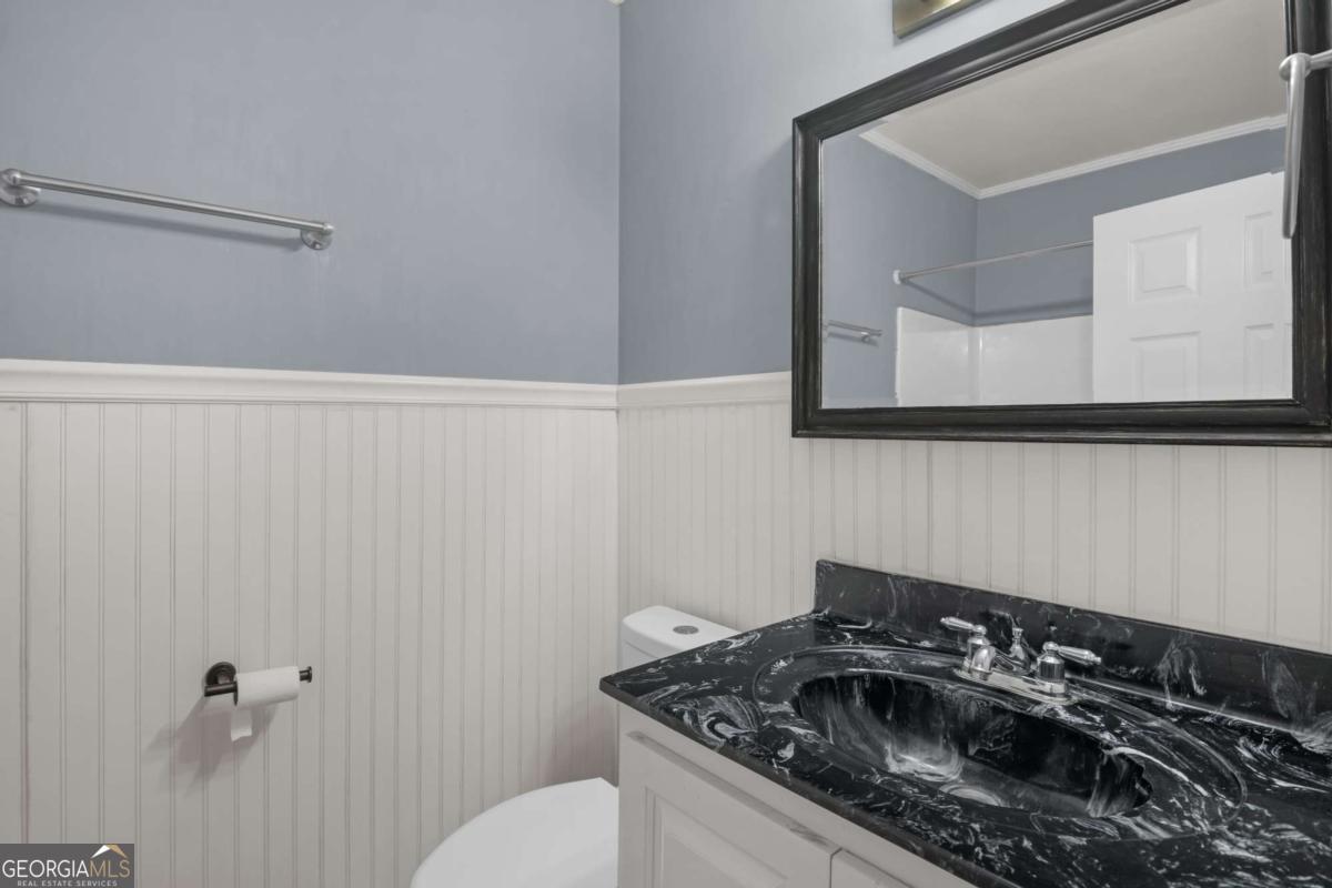 5837 Youmans Chapel Road Blackshear, GA 31516 - Photo 15 of 30 a bathroom with a sink and a toilet
