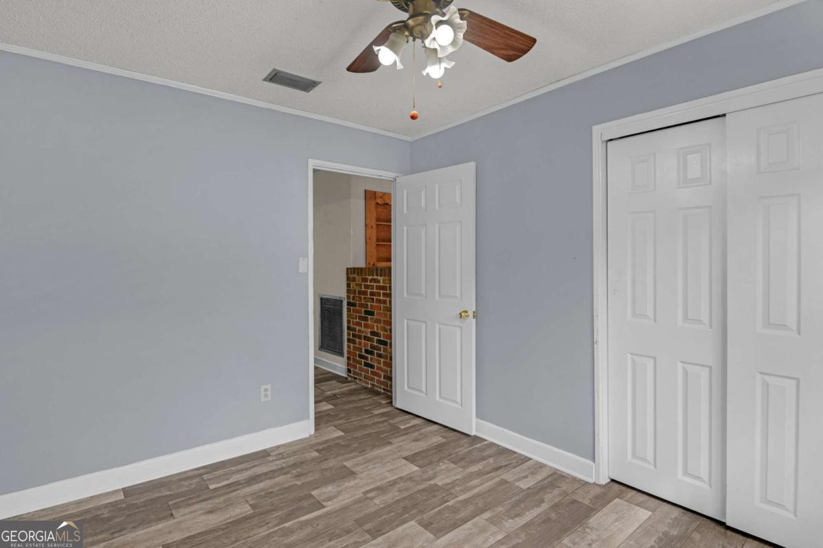 5837 Youmans Chapel Road Blackshear, GA 31516 - Photo 17 of 30 a view of an empty room with a window
