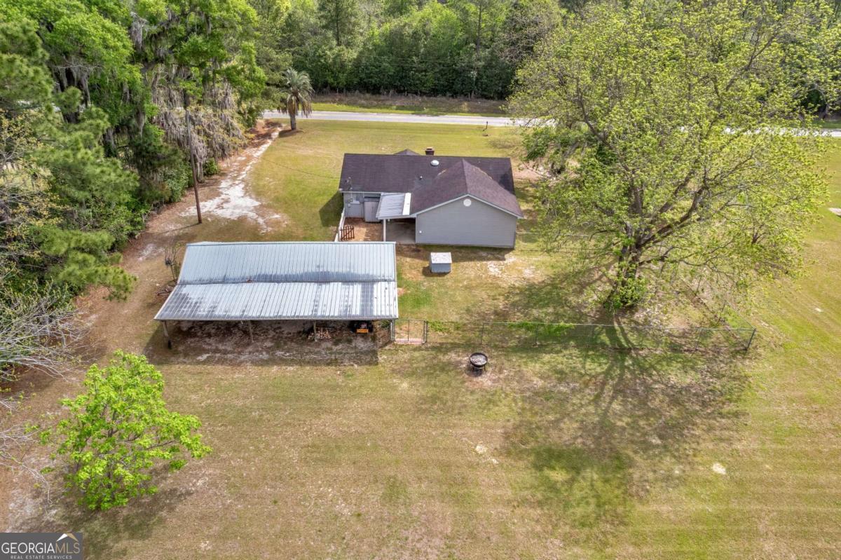 5837 Youmans Chapel Road Blackshear, GA 31516 - Photo 6 of 30 a view of a house with a yard
