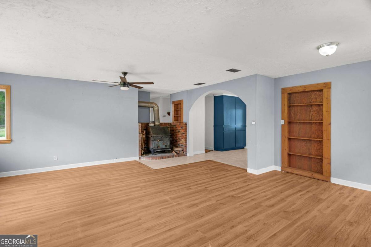 5837 Youmans Chapel Road Blackshear, GA 31516 - Photo 10 of 30 a view of empty room with wooden floor