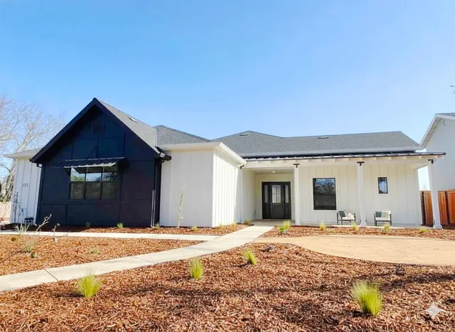 a front view of a house with a yard