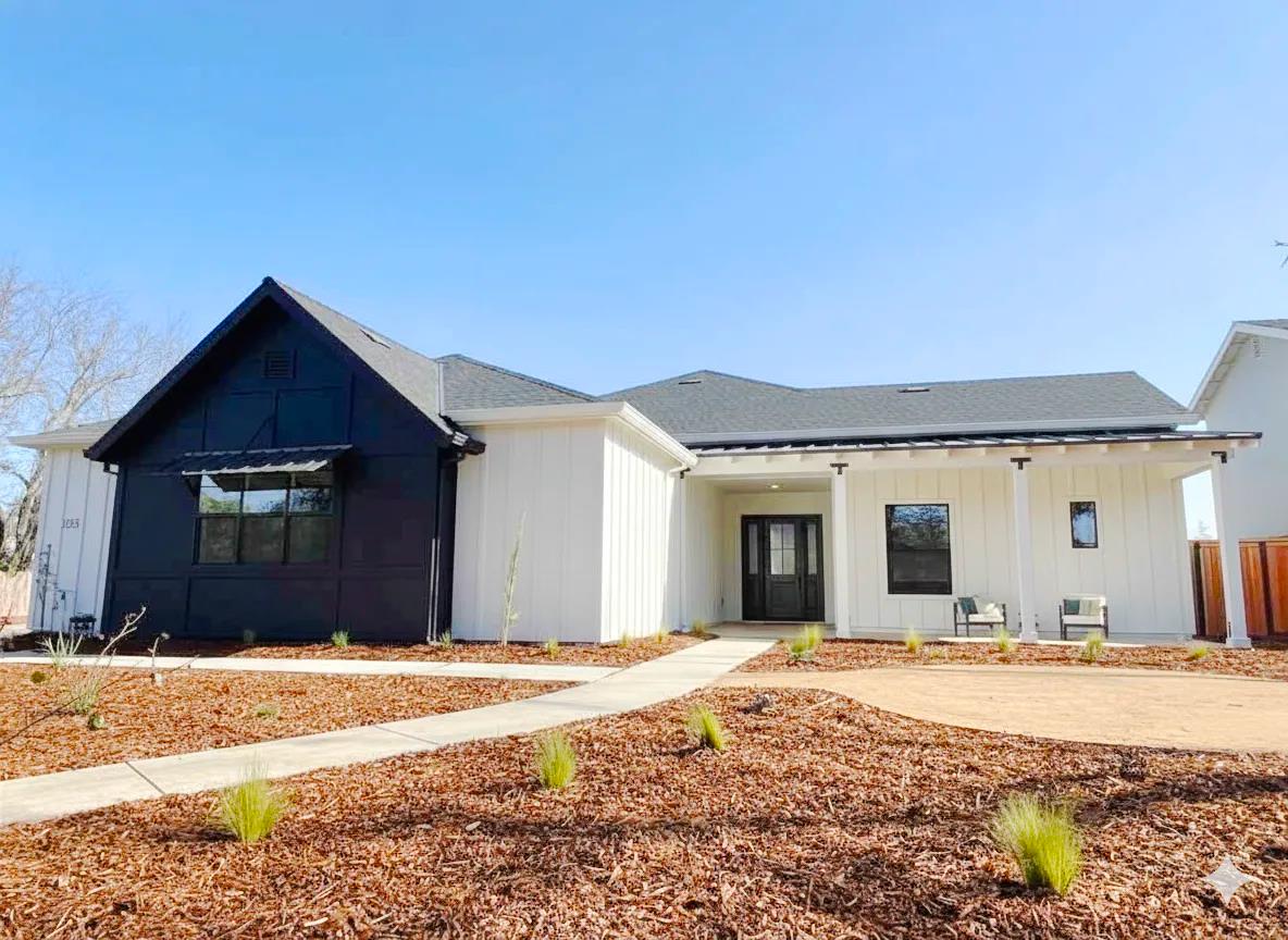 a front view of a house with a yard