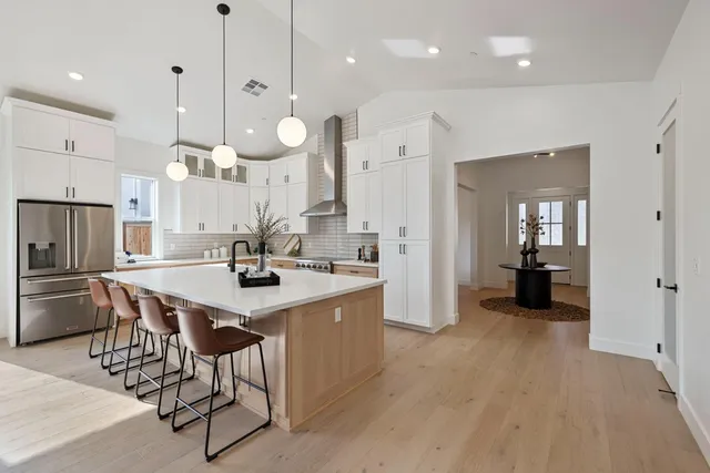 a view of living room and kitchen with a sink