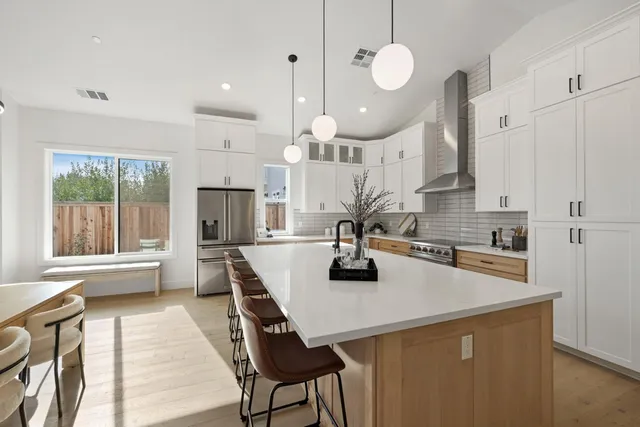 a kitchen with a sink and a refrigerator