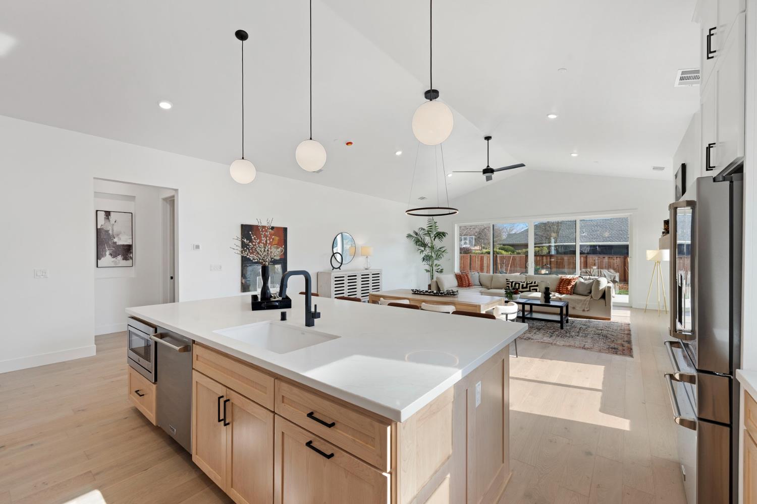 1510 Mission Avenue Carmichael, CA 95608 - Photo 18 of 60 a kitchen with stainless steel appliances a stove a sink a oven a dining table and chairs