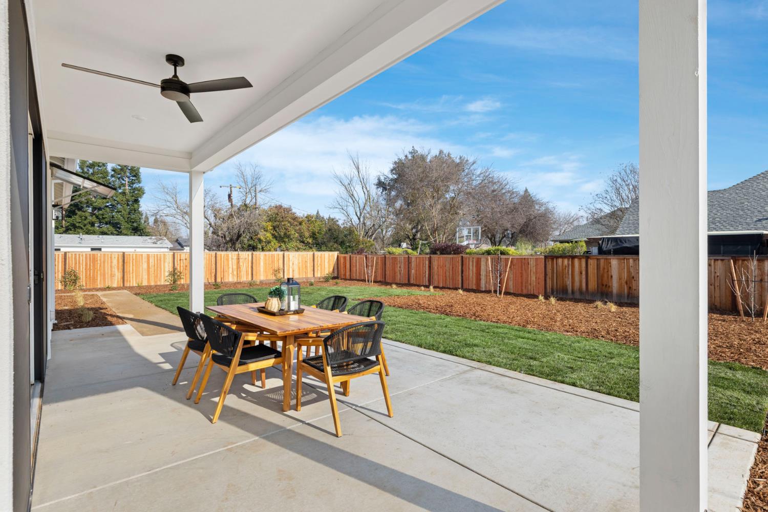 1510 Mission Avenue Carmichael, CA 95608 - Photo 24 of 60 a view of a patio with a table chairs and a backyard