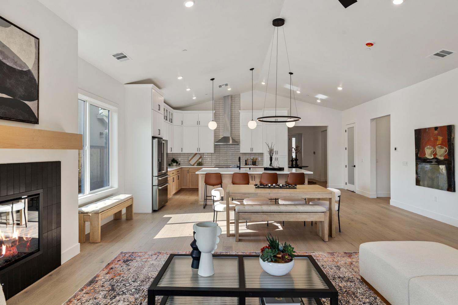 1510 Mission Avenue Carmichael, CA 95608 - Photo 26 of 60 a living room with furniture a fireplace and a chandelier