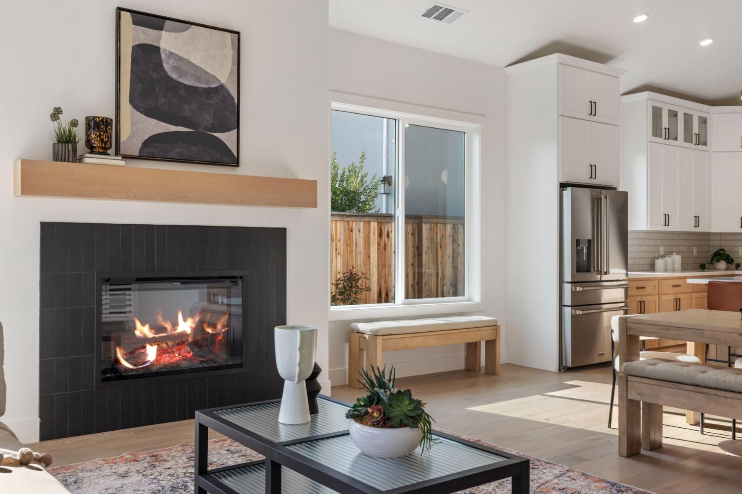 1510 Mission Avenue Carmichael, CA 95608 - Photo 27 of 60 a living room with furniture a fireplace and kitchen view