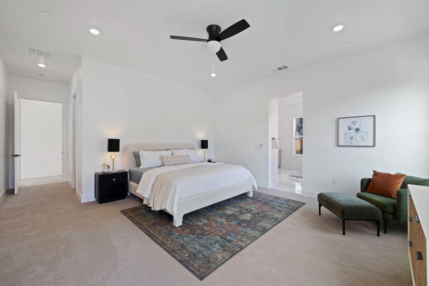 1510 Mission Avenue Carmichael, CA 95608 - Photo 29 of 60 a spacious bedroom with a bed a couch and a chandelier