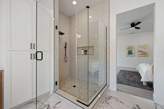 a bathroom with a toilet a sink and a mirror