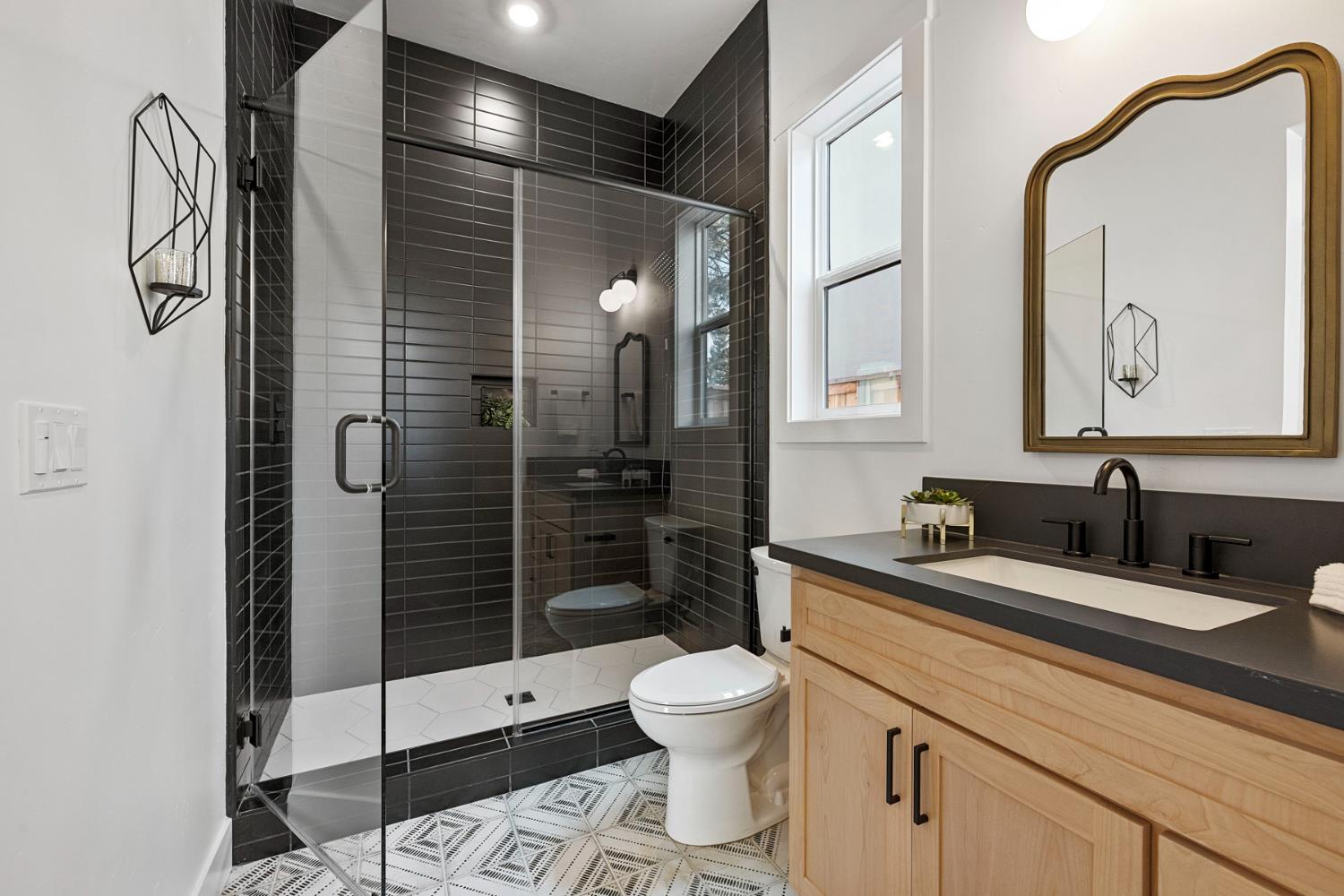 1510 Mission Avenue Carmichael, CA 95608 - Photo 41 of 60 a bathroom with a toilet sink shower and mirror