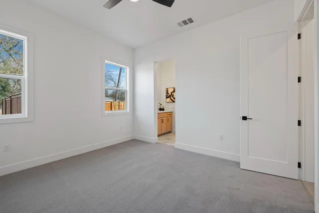 a kitchen with a refrigerator and a sink