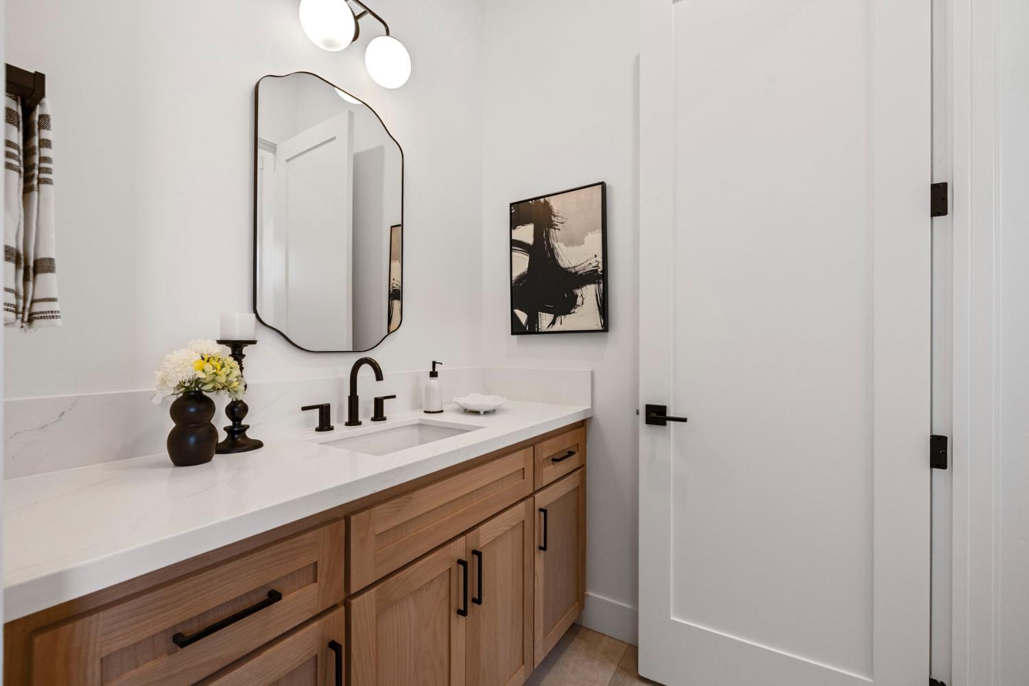 1510 Mission Avenue Carmichael, CA 95608 - Photo 50 of 60 a bathroom with a double vanity sink and a mirror