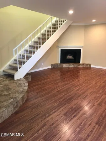 a view of an entryway with wooden floor