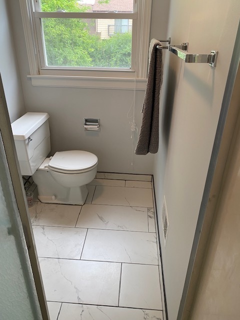 3420 Winnetka Road Glenview, IL 60026 - Photo 20 of 26 a bathroom with a toilet and a shower