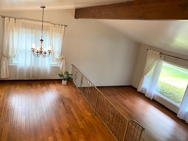 3420 Winnetka Road Glenview, IL 60026 - Photo 2 of 26 a view of hallway with wooden floor and windows