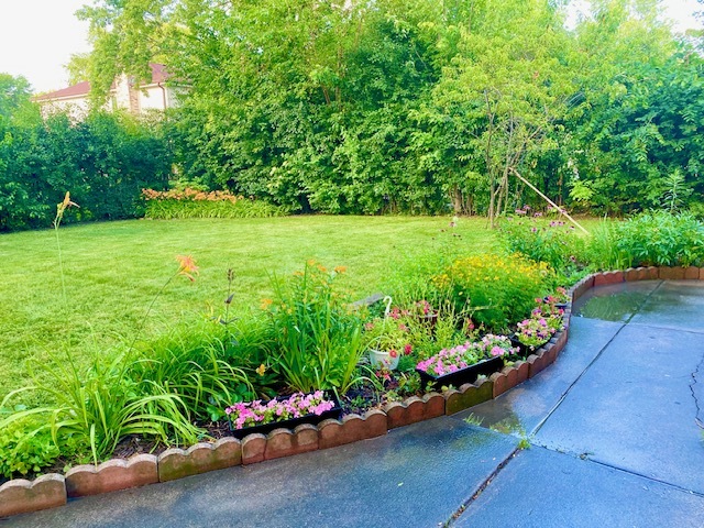 3420 Winnetka Road Glenview, IL 60026 - Photo 26 of 26 a view of a garden with a bench in a garden