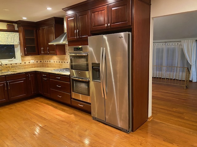 3420 Winnetka Road Glenview, IL 60026 - Photo 6 of 26 a kitchen with stainless steel appliances granite countertop a refrigerator and a sink