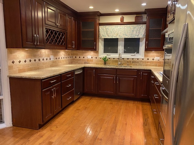 3420 Winnetka Road Glenview, IL 60026 - Photo 7 of 26 a kitchen with stainless steel appliances granite countertop a sink and a stove