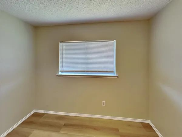 a view of a small space with wooden floor