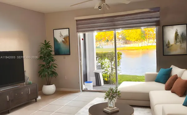 a living room with furniture and a potted plant