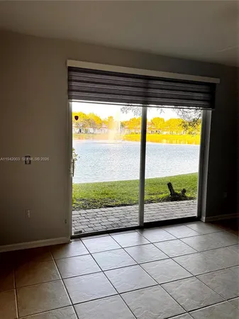 a view of an empty room and window