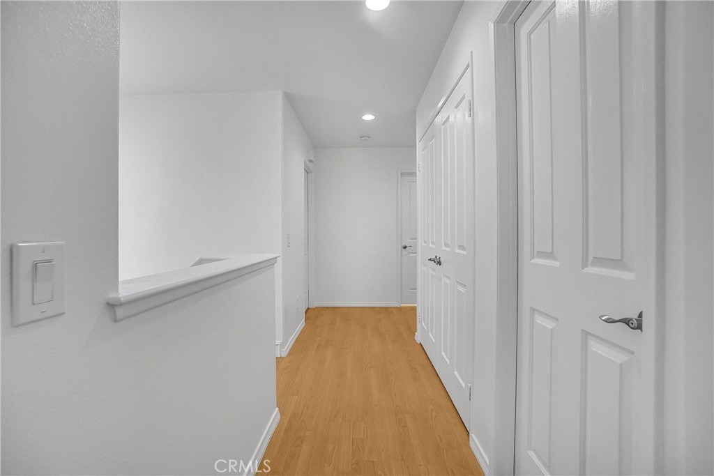 76 Millbrook Irvine, CA 92618 - Photo 25 of 51 a view of a hallway with wooden floor and entryway