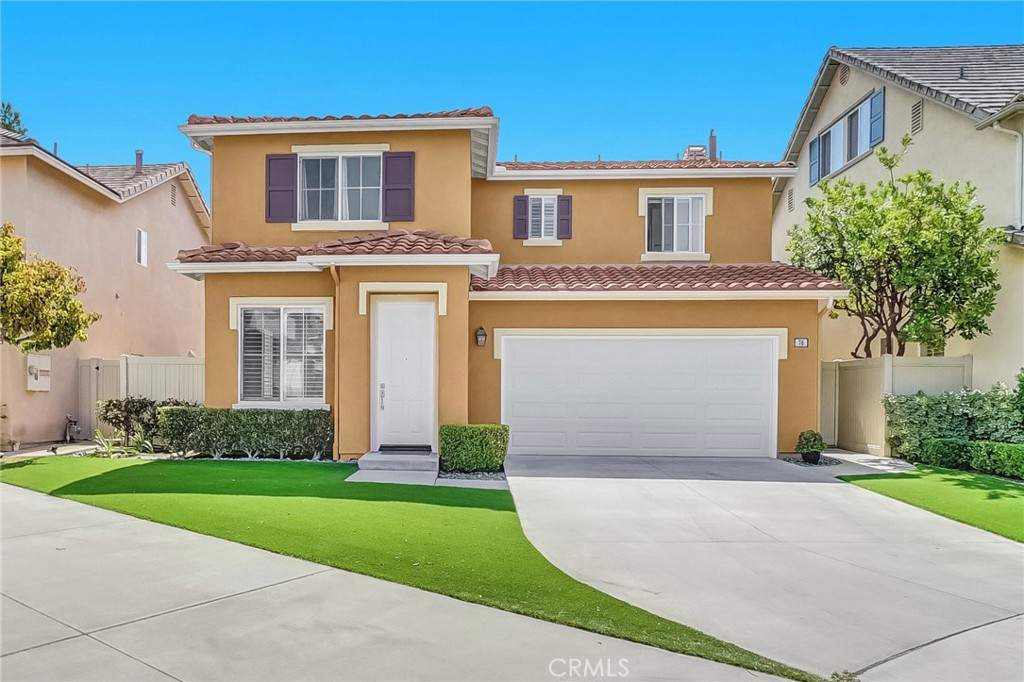 76 Millbrook Irvine, CA 92618 - Photo 43 of 51 a front view of a house with a yard and garage