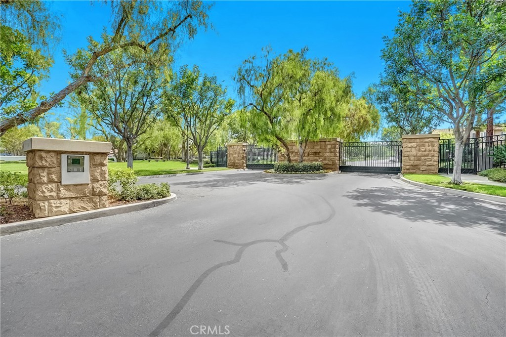 76 Millbrook Irvine, CA 92618 - Photo 51 of 51 a view of a house with palm trees