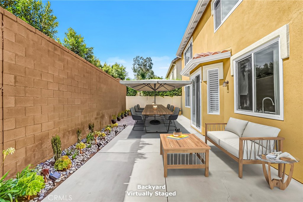 76 Millbrook Irvine, CA 92618 - Photo 7 of 51 a front view of a house with outdoor seating