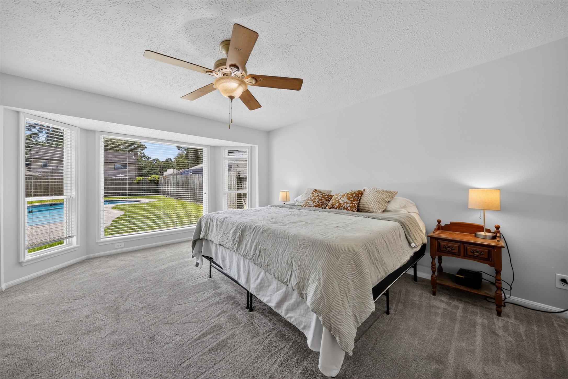 5211 Nodaway Lane Spring, TX 77379 - Photo 20 of 41 Primary Bedroom - plenty of room for Bureau, Dresser and King Size bed. Note view into backyard Pool & Spa area.