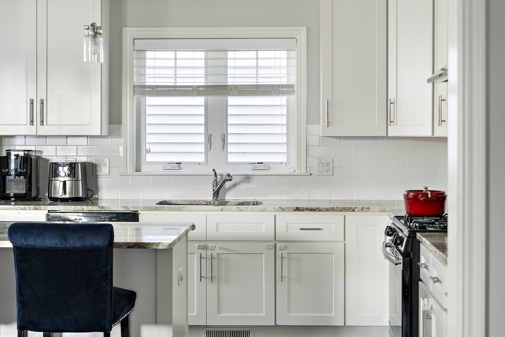 25 Oxbow Road, Unit 25 Framingham, MA 01701 - Photo 18 of 34 a kitchen with a sink cabinets and window