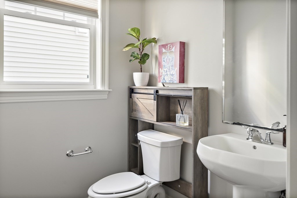 25 Oxbow Road, Unit 25 Framingham, MA 01701 - Photo 19 of 34 a bathroom with a toilet a sink and a window